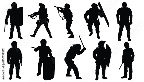 Law enforcement officers in riot gear with shields and batons