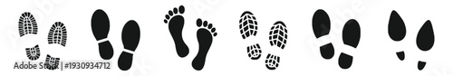 Set of black silhouette footprints and shoe prints on white background