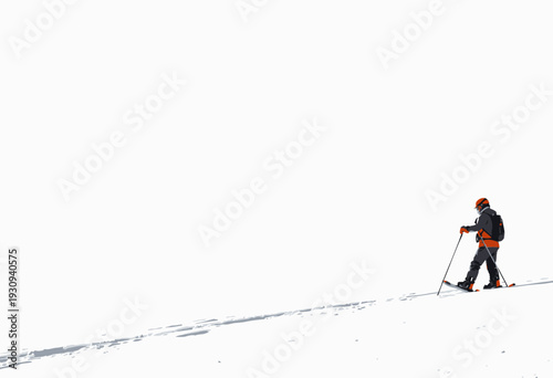 Lone skier ascending a snowy mountain slope under a vast, open sky, highlighting the solitude and adventure in winter sports and the beauty of the natural landscape