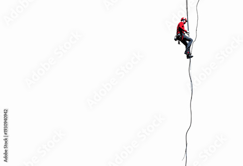 Daring Climber Ascends a High Rope Against a Minimalist White Background Demonstrating Skill and Precision in Vertical Climbing and Safety Gear Usage