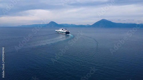 Ferry Boat Sailing Across Quiet Gulf With Distant Island