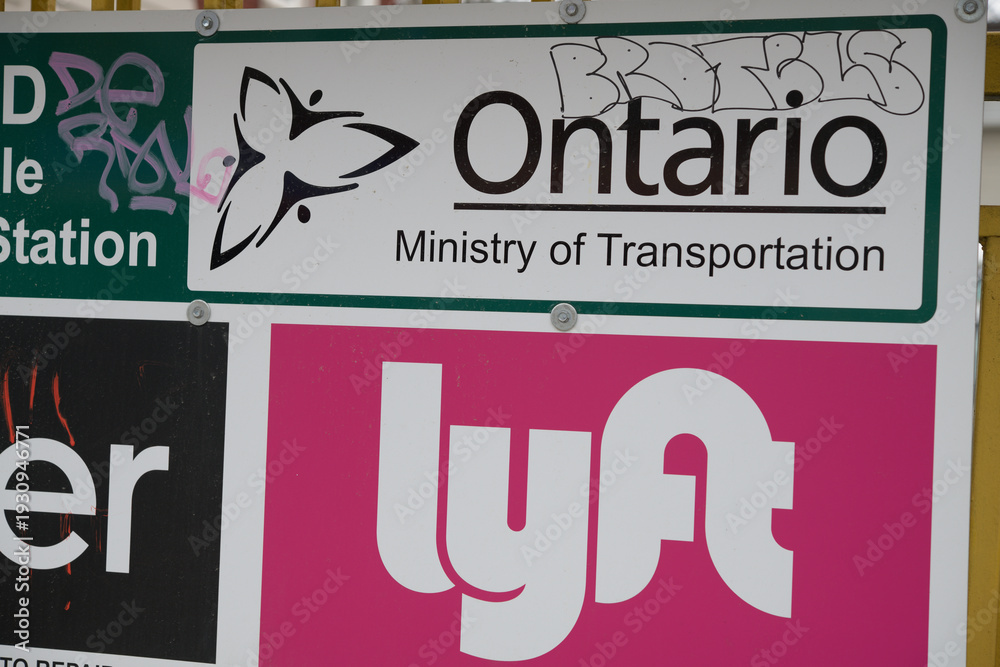 Naklejka premium Ontario Ministry of Transportation and Lyft logo signs in Toronto