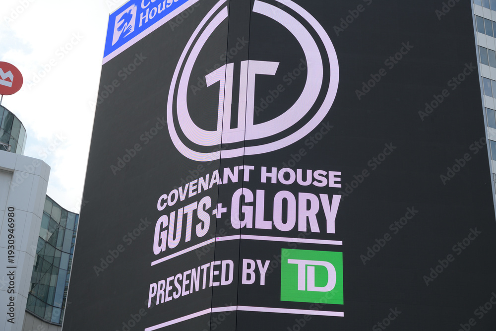 Fototapeta premium digital announcement ad sign for March 5, 2026, Covenant House Toronto, event called Guts + Glory: The Ultimate Brain + Brawn Challenge, Sankofa Square