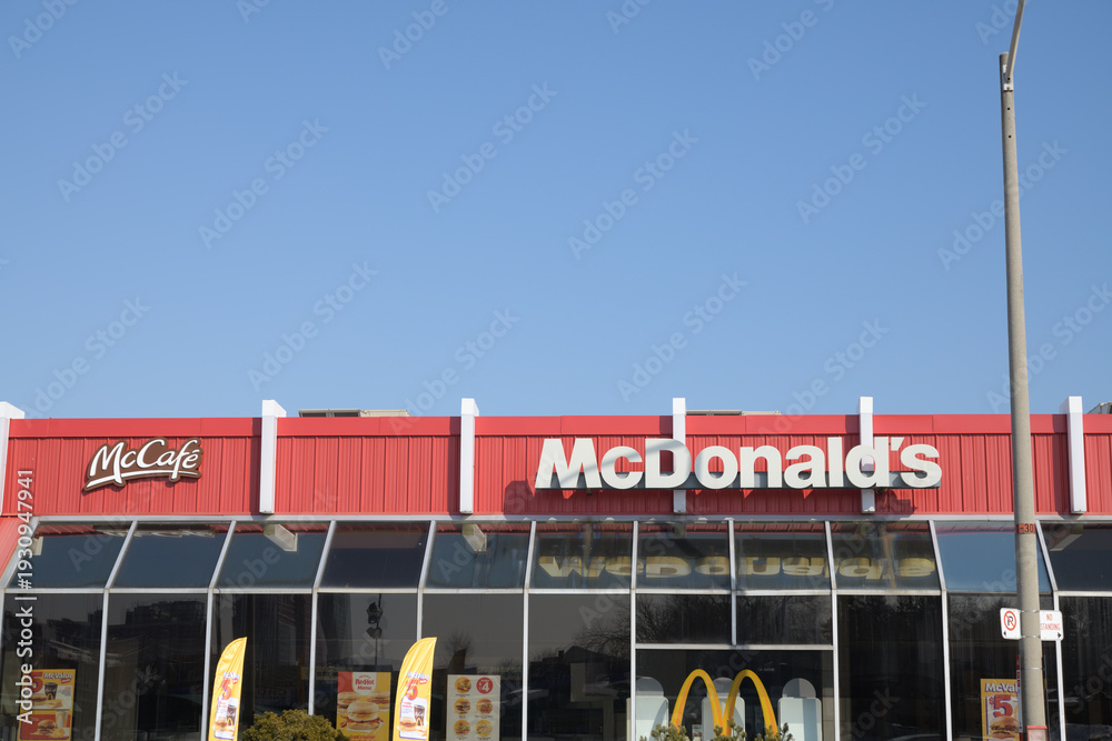 Fototapeta premium exterior building and sign of McDonald's fast food restaurant at 2480 Gerrard St E (seen from Victoria Park Av), Toronto
