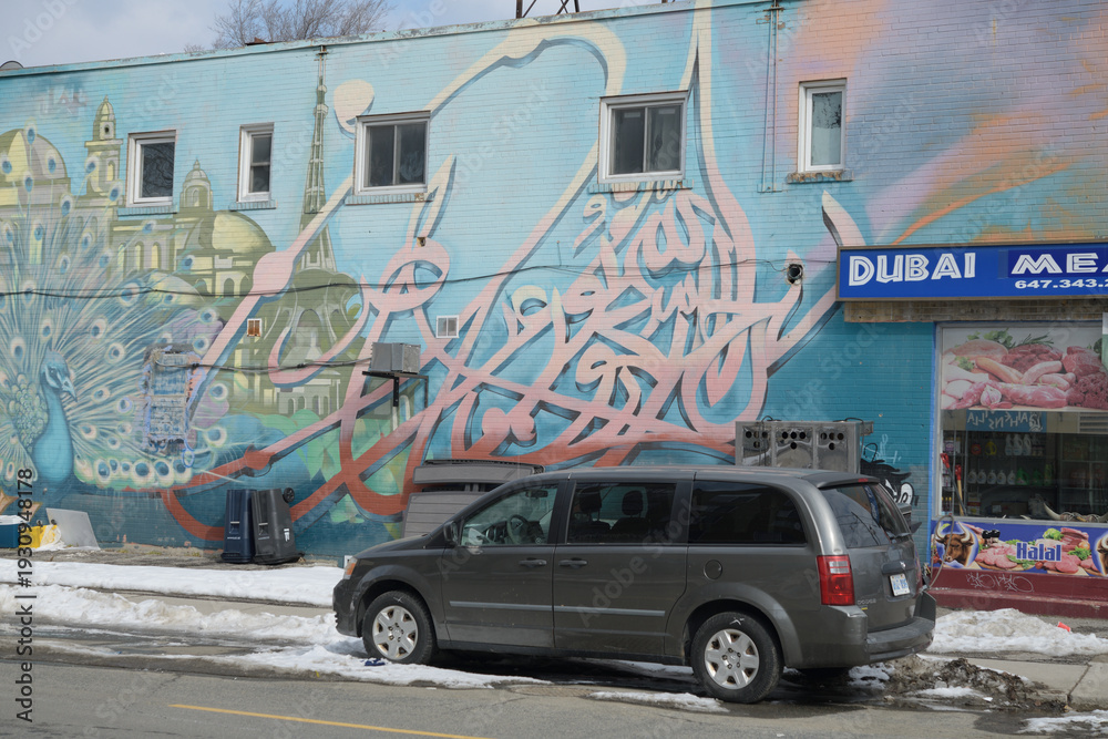 Naklejka premium mural on the exterior (west facing wall) of 1322 Gerrard St E (location of Dubai Meat Shop), Gerrard India Bazaar, Toronto
