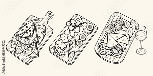 Three wooden boards displaying various cheese fruit and charcuterie