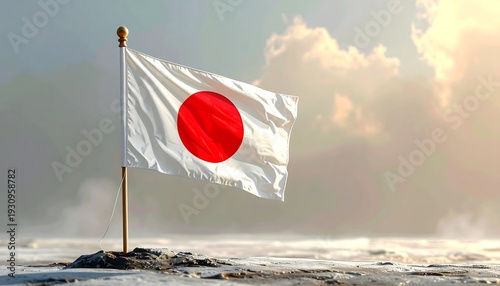 Japanese flag waving proudly against a cloudy sky.