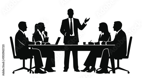 Business team meeting around a table a striking black silhouette