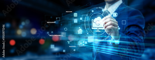 Businessman pointing at data backup technology on futuristic digital interface screen, cloud storage solution, cybersecurity protection, disaster recovery system, information security concept