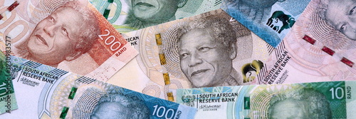 Wallpaper Mural South African rand money bills pile on table. South Africa banknotes of ZAR currency close up. Torontodigital.ca