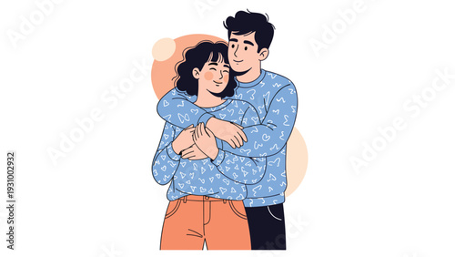 Happy young couple in love hugging and wearing matching blue sweaters with patterns against a simple background.