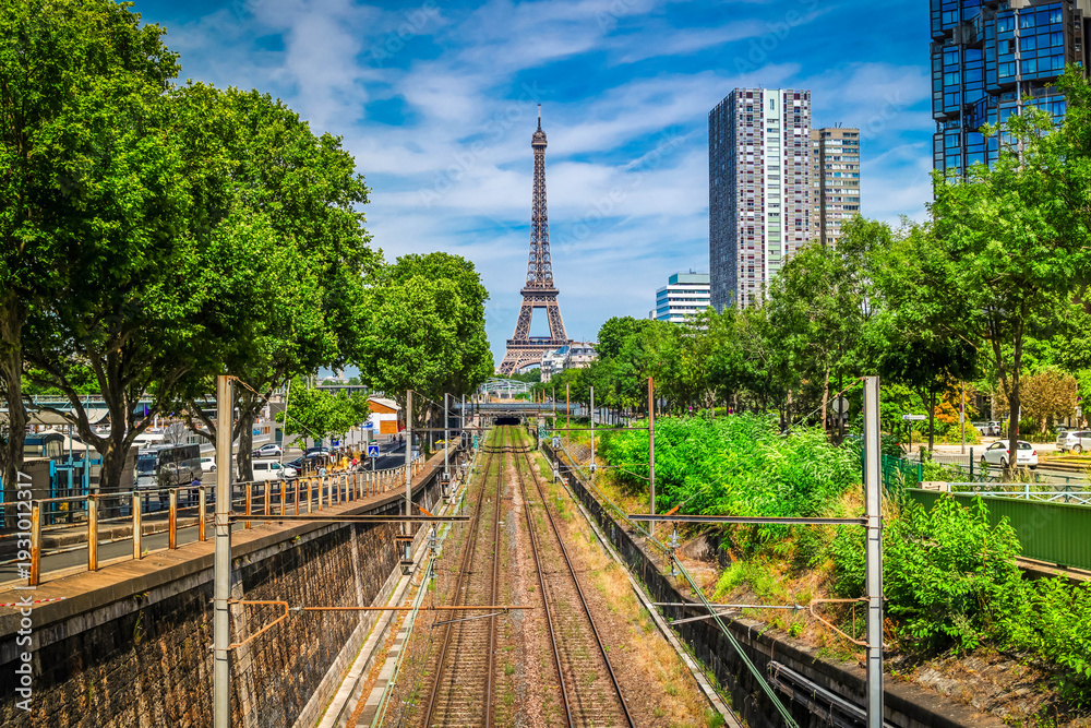 Obraz premium Eiffel Tower with moden houses raiload, Paris, France