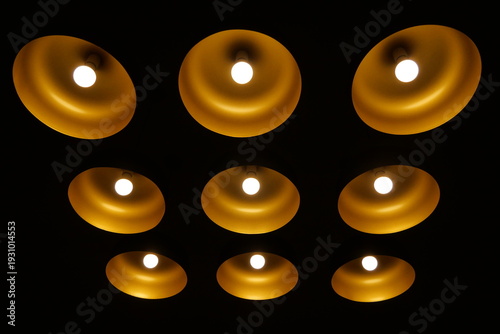 The dim lights on the ceiling are installed in rows close together, appearing to form a decorative pattern.