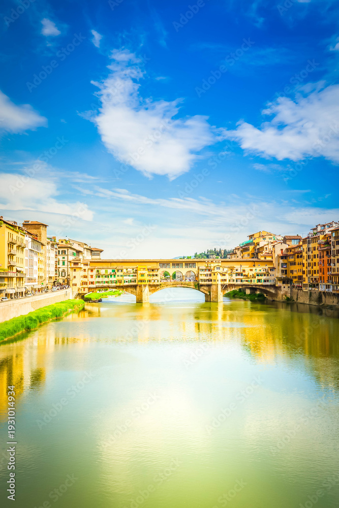 Fototapeta premium famous bridge Ponte Vecchio over river Arno at summer day, vertical shot, Florence, Italy