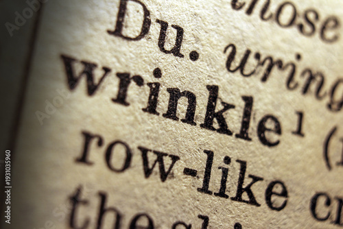 Photos Word wrinkle printed on a dictionary page, macro closeup
