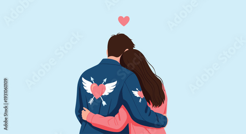 Romantic couple is shown from behind hugging each other while wearing blue and pink jackets decorated with winged heart symbols.