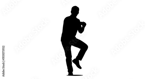 Full body silhouette of a man in motion focused on an object