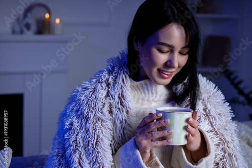 Young woman with warm blank...
