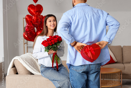 Young man with gift box and...