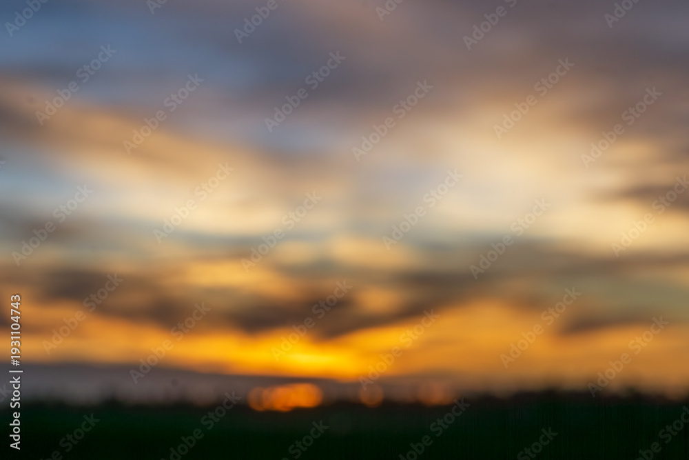 Fototapeta premium Stunning sunset view with vibrant colors reflecting on calm horizons during twilight hours in a serene landscape