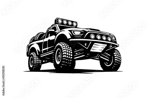 Low-angle perspective of a desert rally vehicle emphasizing lifted suspension