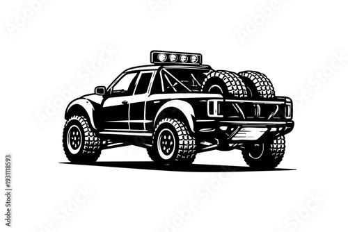 Rear three-quarter view of a desert rally vehicle showing spare tire mount