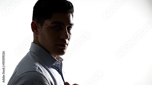 Thoughtful man's profile in silhouette against white background
