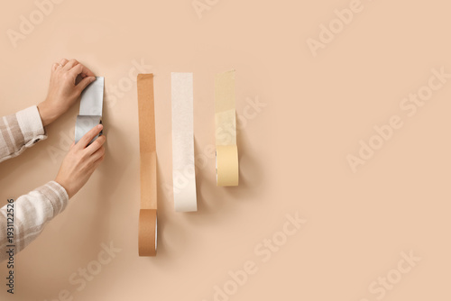 Female hands with adhesive ...
