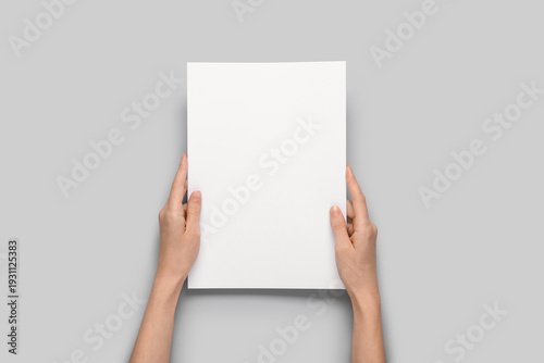Female hands holding blank ...