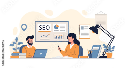 Two people discussing SEO strategy at a desk with laptops.