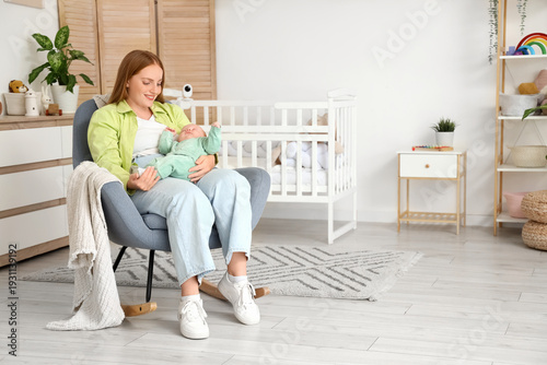 Beautiful young mother with...