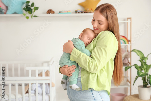 Beautiful young mother with...