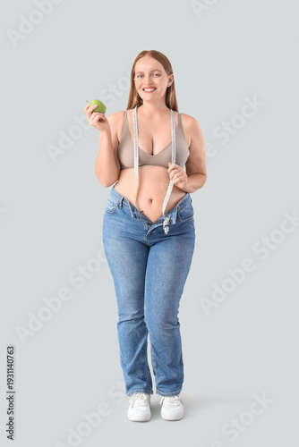 Young happy overweight woma...