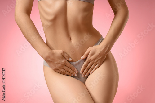 Photos Young woman in panties on pink background, closeup