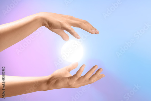 Female hands with ball of e...