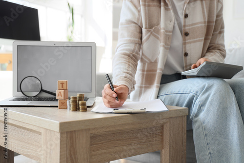 Woman with blank laptop and...