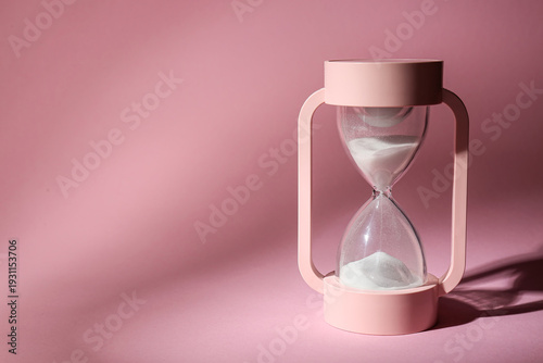 Crystal hourglass on pink b...