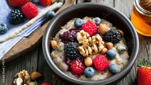 Vibrant and nutritious breakfast scene with oatmeal, blueberries, raspberries, and nuts, highlighting healthy eating and delicious flavor combinations in close-up view.