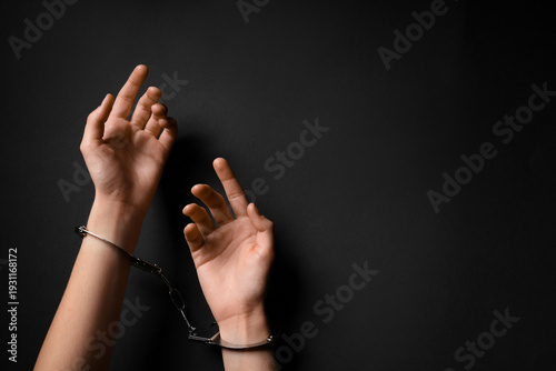Female hands in handcuffs o...
