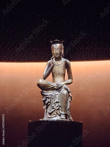 Bodhisattva in pensive position in Museum Gallery