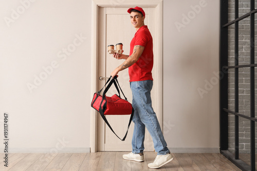 Male courier delivering foo...