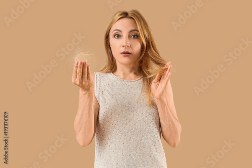 Worried mature woman with h...