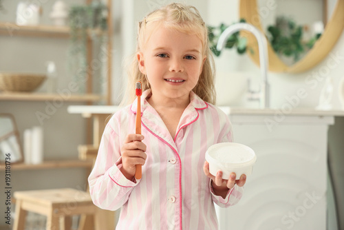 Cute little girl with tooth...