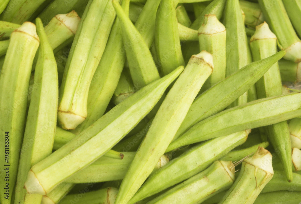 Fototapeta premium Fresh okra vegetables close up as background