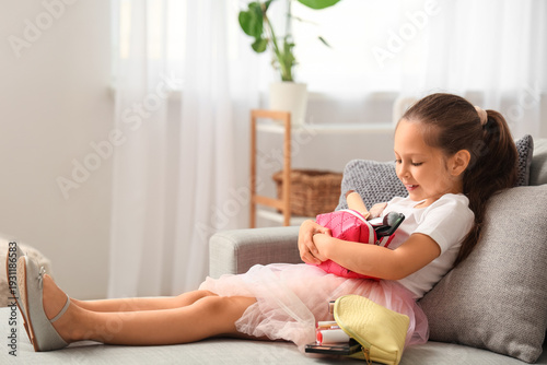 Cute little girl with cosme...