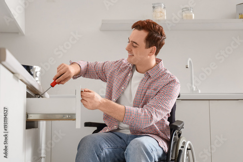 Young man in wheelchair rep...