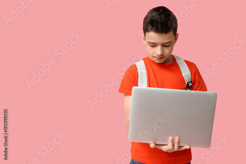 Schoolboy using modern lapt...