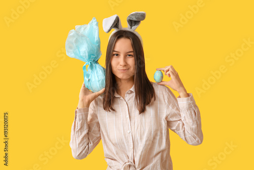 Pretty young woman with bun...
