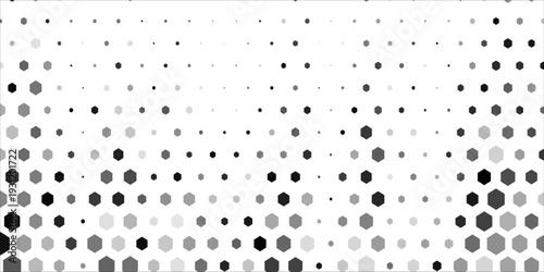 Abstract grayscale hexagon pattern with a honeycomb structure that gradually transitions into scattered dots. Modern geometric background