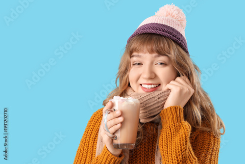 Pretty young woman holding ...